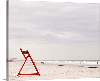 Red life guard chair on beach