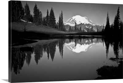 Reflection of Mount Rainer in calm lake at dawn.