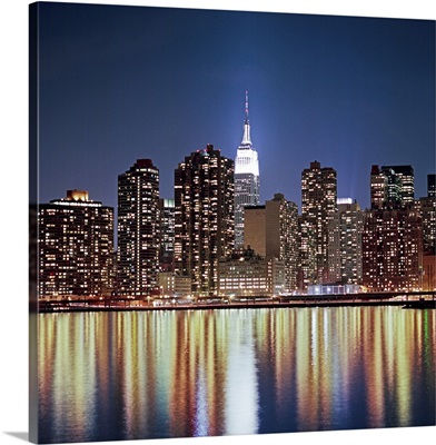 Reflection of skyline at night, New York, USA.