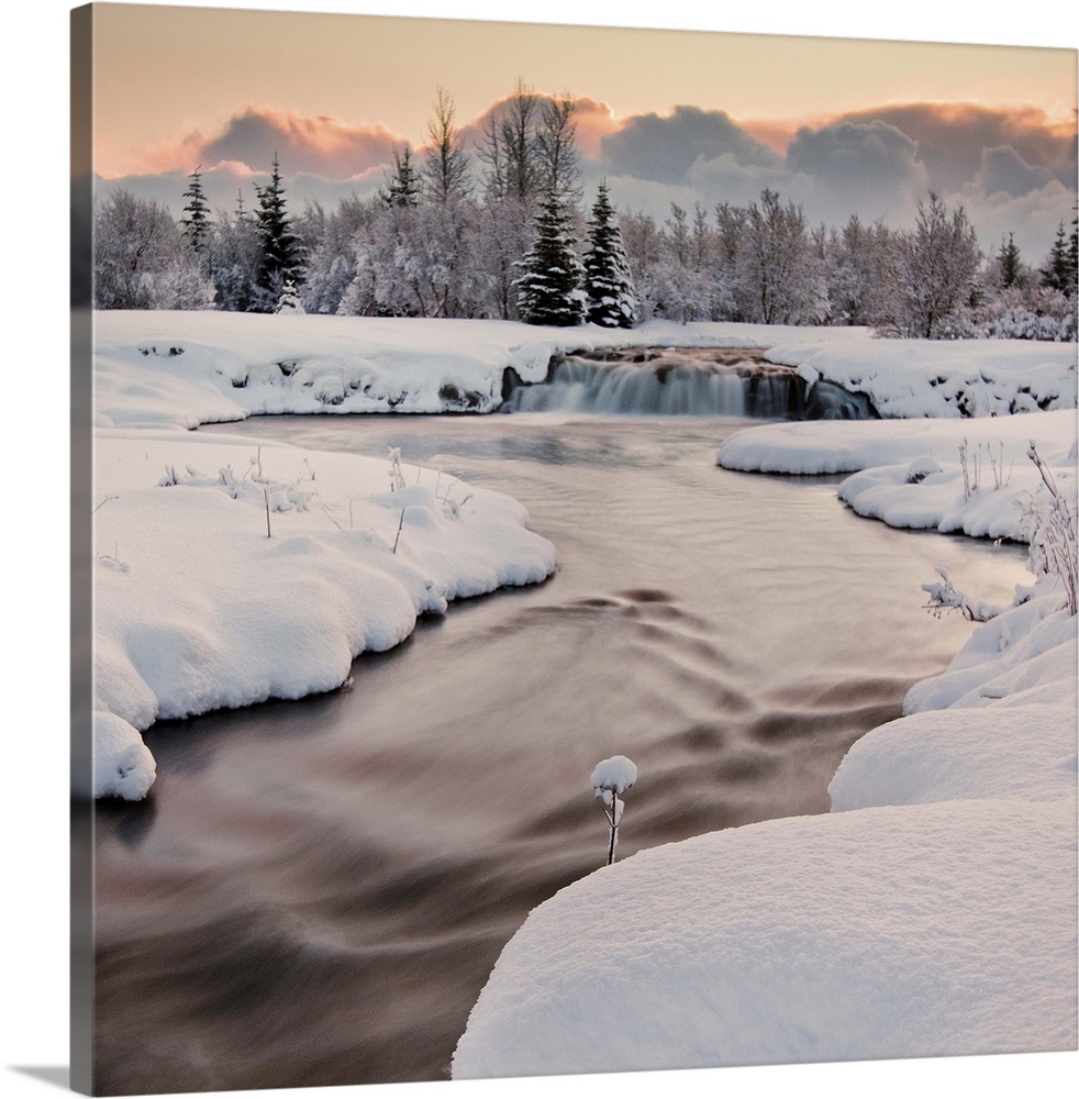 River covered with snow at winter, Iceland.