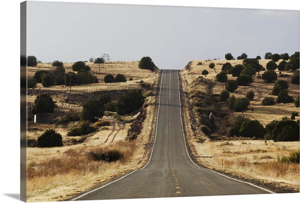 The famous road, Route 66, stretches across the Arizona desert near Seligman, NM.