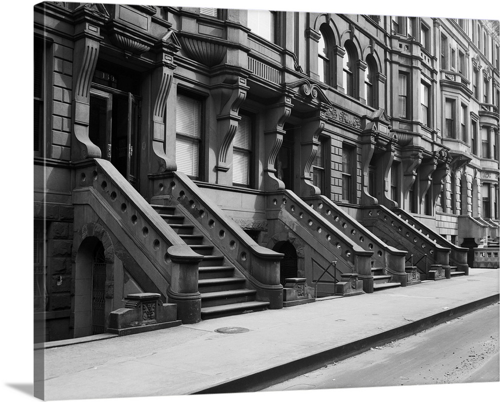 3/1951-New York, NY: A row of brownstone stoops and doorways in New York City.