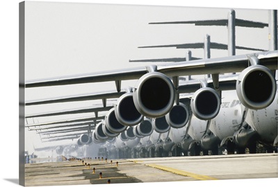 Row of McDonnell Douglas C-17 Globemaster III planes on runway