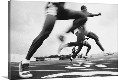 Runners racing on track