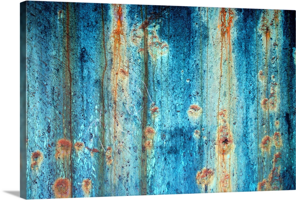 Large photograph shows a rough textured surface that has been heavily affected by oxidation and corrosion.