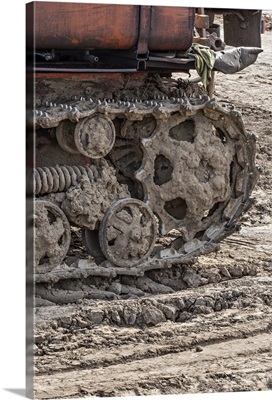 Rusted metal treads on a backhoe