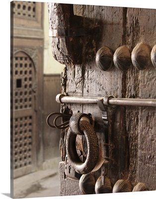 Rustic, heavy, ornate wooden door