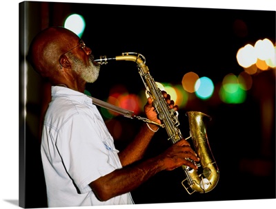Saxophonist on street at night, New Orleans, Louisiana, USA