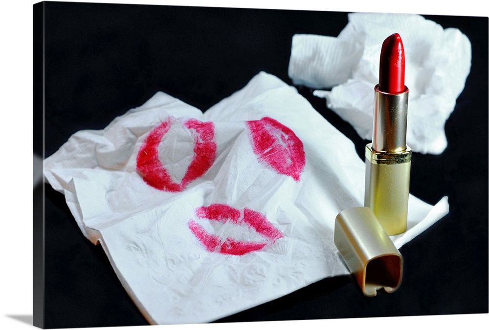Still Life of red lipstick and napkin with lipstick stains.
