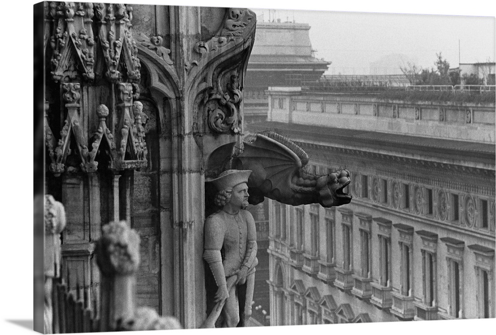 A crying griffin and an armed soldier stand guard on an upper corner of Il Duomo in Milan, Italy.