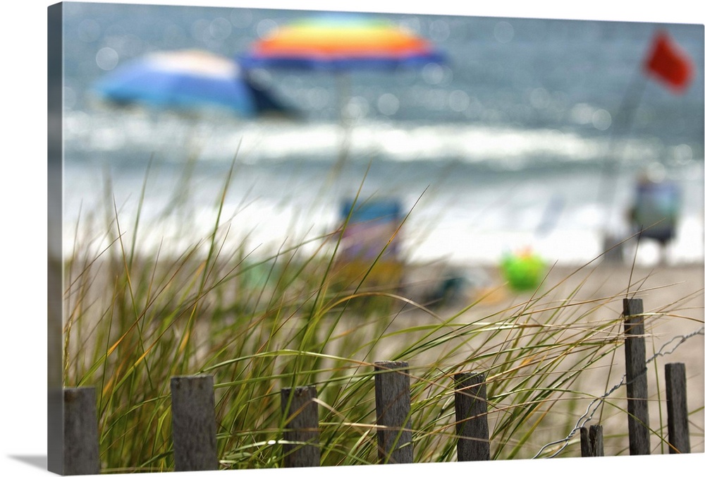 Selective focus of tourists enjoying the beach