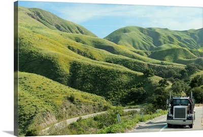 Semi-truck driving on remote highway