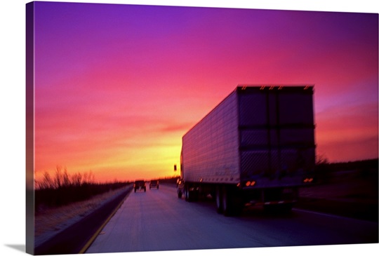 Semi truck on road at sunset Wall Art Canvas Prints 