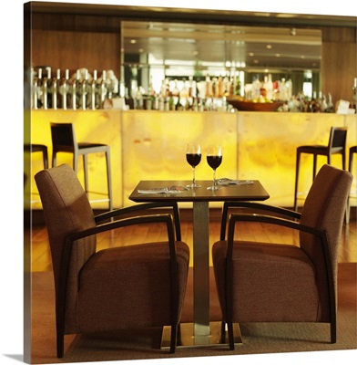 Side view of table and chair in hotel bar