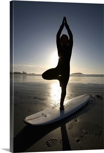 silhouette of female surfer doing yoga tree pose | Great Big Canvas