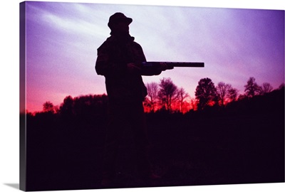 Silhouette of hunter with gun