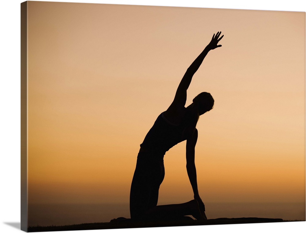 Silhouette of person stretching