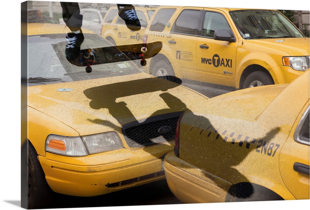 Skate boarding over New York taxis, composite