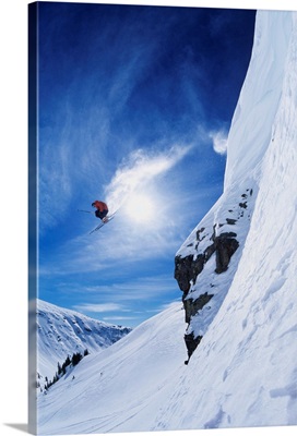 Ski Jumper Going Over Cliff
