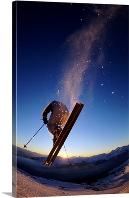 Skier in mid air, sunset