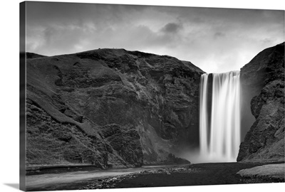 Skogafoss waterfall plunges over old sea cliffs on south coast of Iceland.