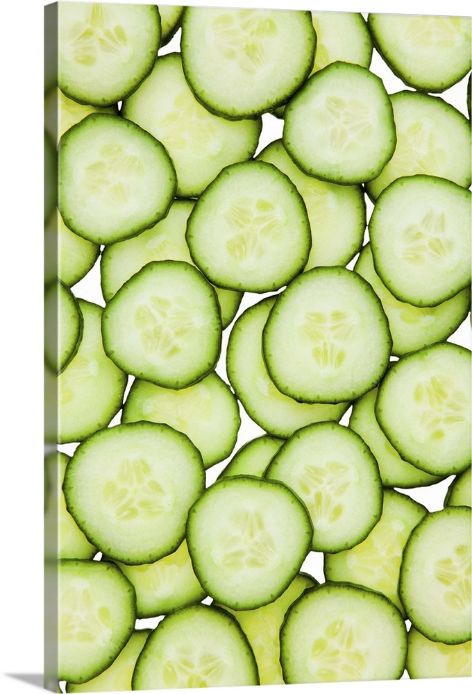 Full frame of sliced cucumber, on white background, cut out
