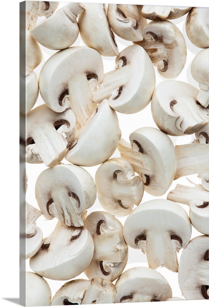 Sliced button mushrooms (agaricus bisporus), on white background, cut out