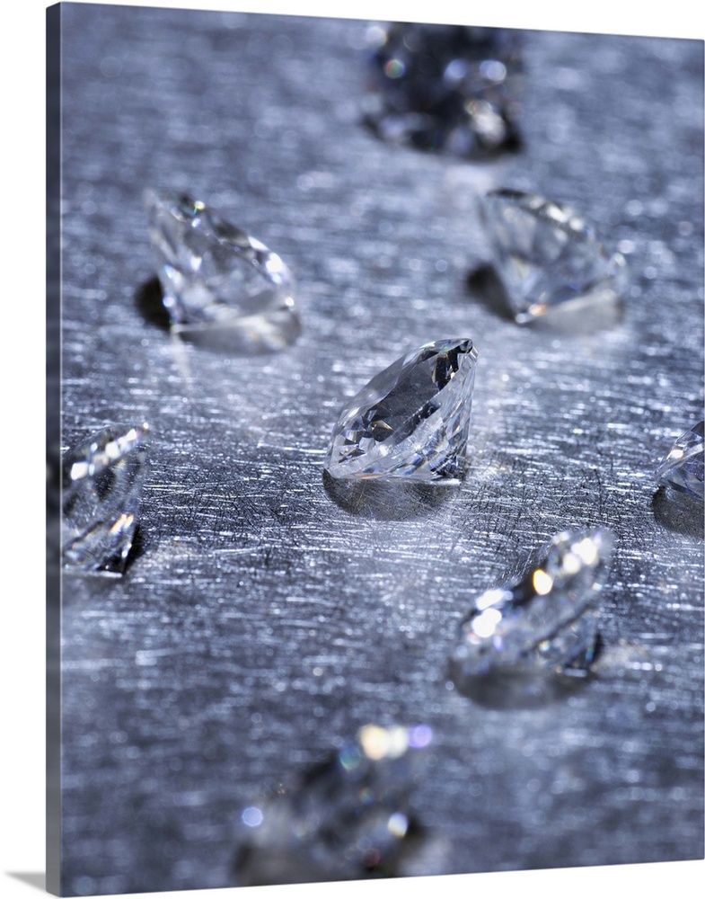 Small diamonds on metal surface, close-up (differential focus)