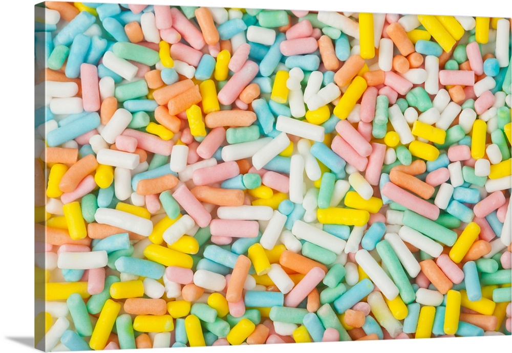 Macro image of a small scoop of pastel-colored dessert sprinkles. Shot in-studio with Canon 5D2 and 100 Macro.