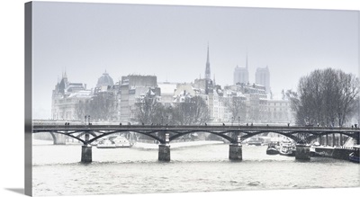 Snow covered bridge in Paris