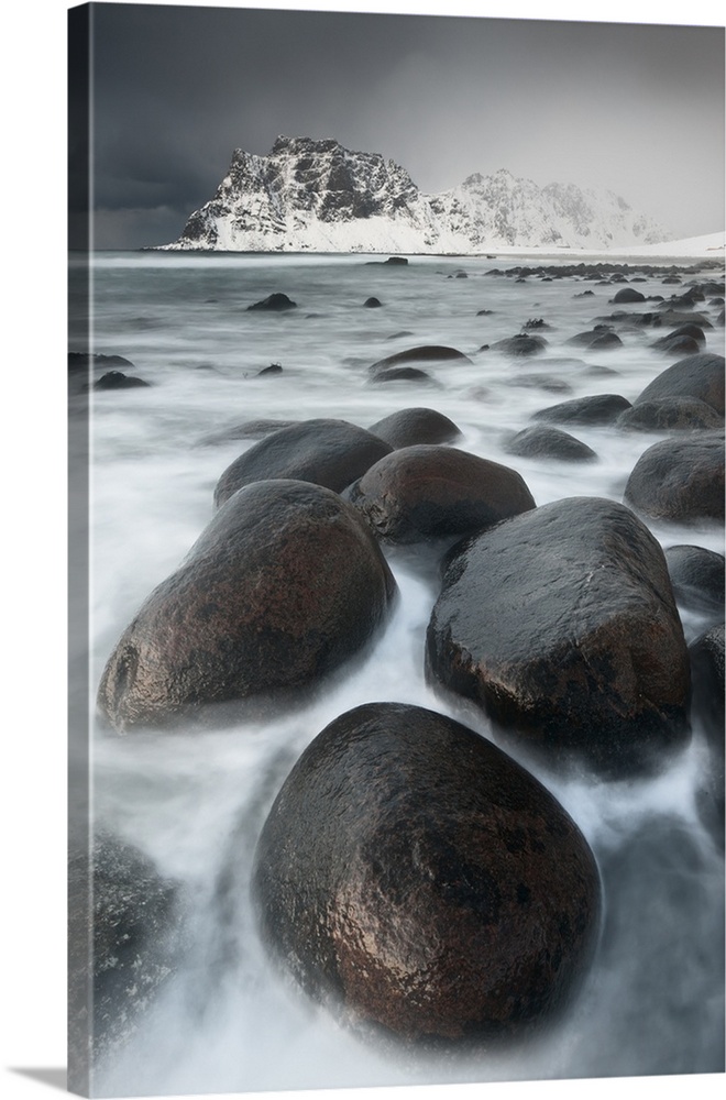 Snow storm hits a mountain on the coast at Utakleiv in the Lofoten Islands, Norway