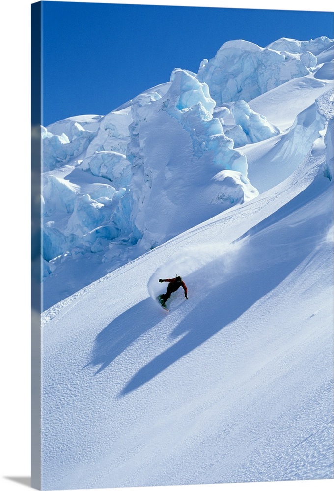 Snowboarder on mountain snowboarding
