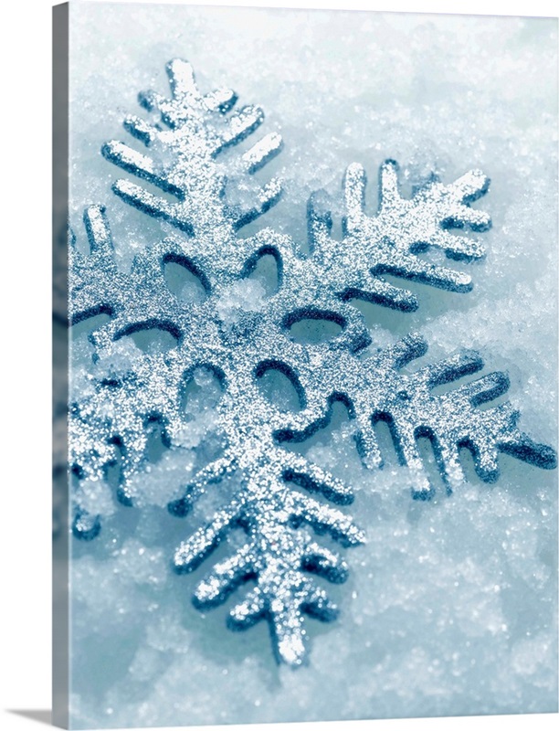 Snowflake Shaped Christmas Ornament Lying In The Snow | Great Big Canvas