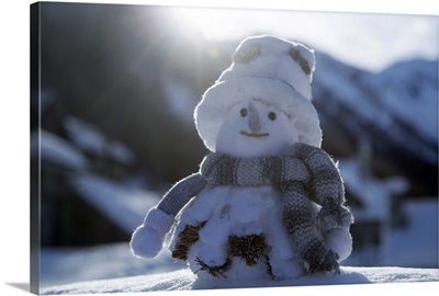 Snowman in snowy mountains