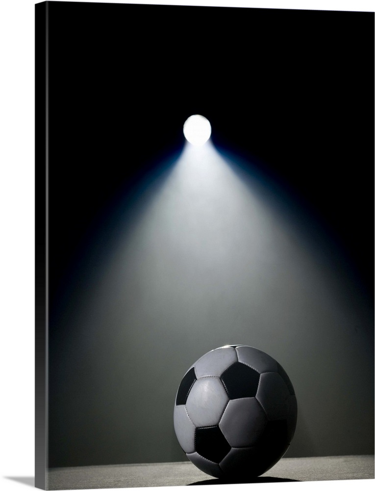 Soccer ball in spotlight
