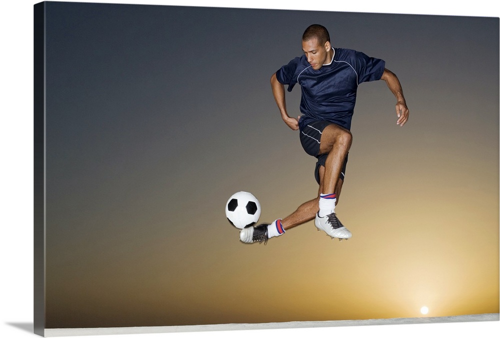 This athletic wall art for a childos room or office shows a man in the air contorting his body to kick the ball.