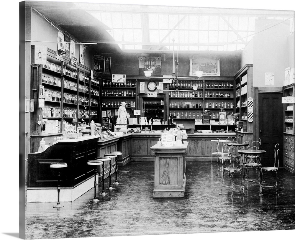 Drug store of the early 1900's. Shows typical fountain and wire ice cream parlor chairs. Professional prescription departm...