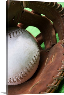 Softball in catcher's glove
