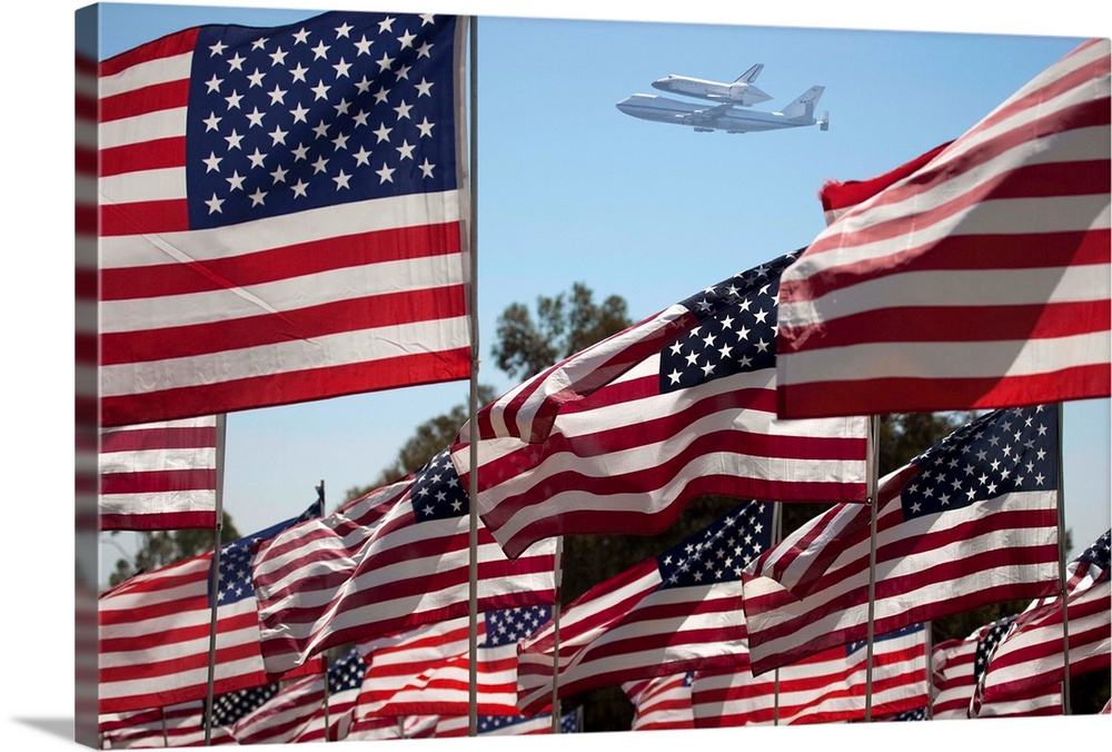 The final flight of the Space Shuttle Columbia flies on 9/21/12 over US Flags at Peperdine University in Malibu, CA