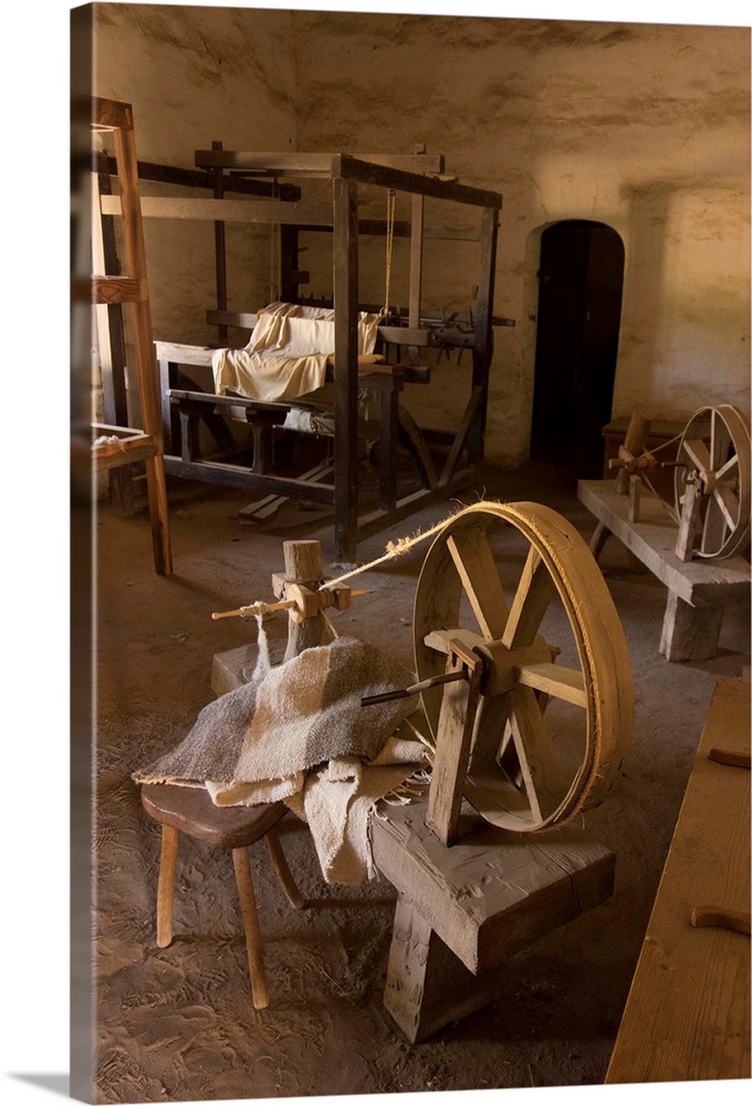 Traditional spinning wheel and looms stand in the weaving room, one of the crafts demonstration rooms in La Purisima Missi...
