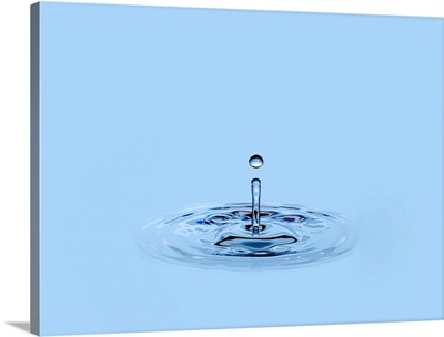 Splashing waterdrop (droplet) falling into water