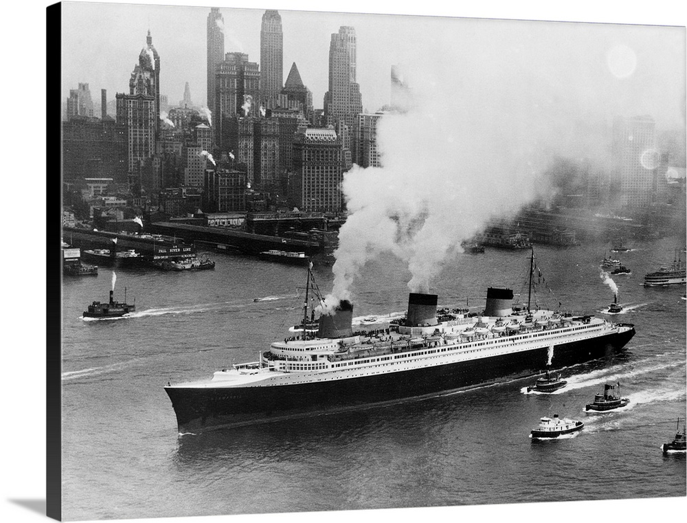 Tugboats follow alongside the French turbine-electric ocean liner SS Normandie as it travels through New York Harbor.