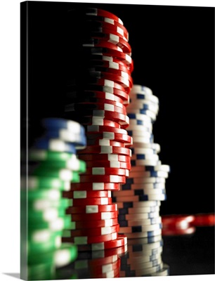 Stacks of gambling chips, close-up (focus on red chips)