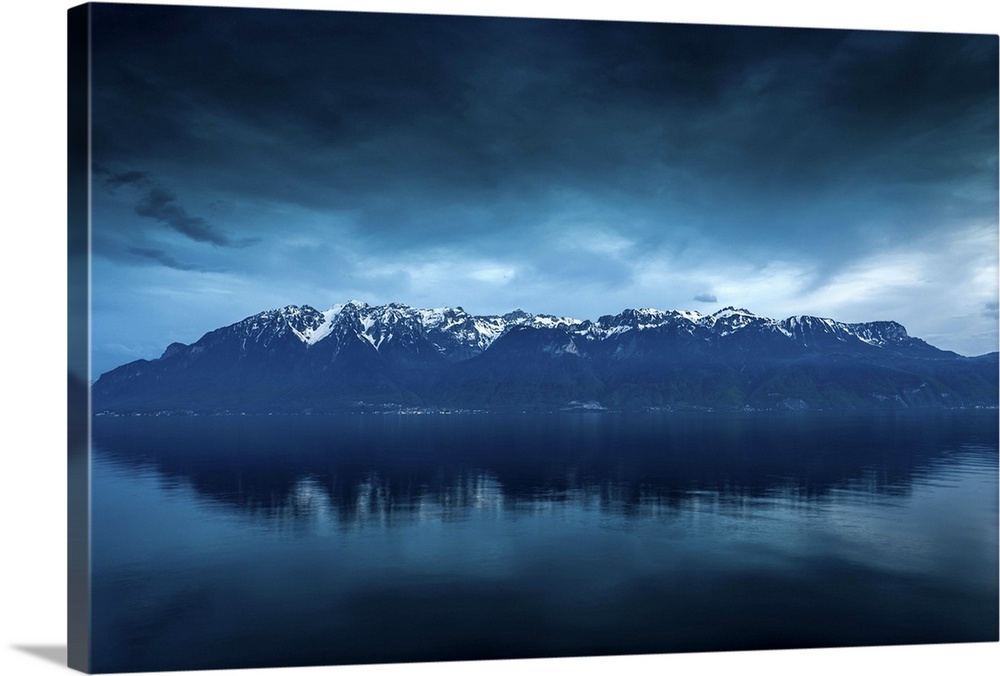 Storm on the snowy French Alps and Lake Geneva as viewed from Saint-Saphorin on the Swiss side.