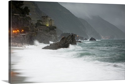 Stormy seascape looking to the lights of Vernazza from Monterosso al Mare