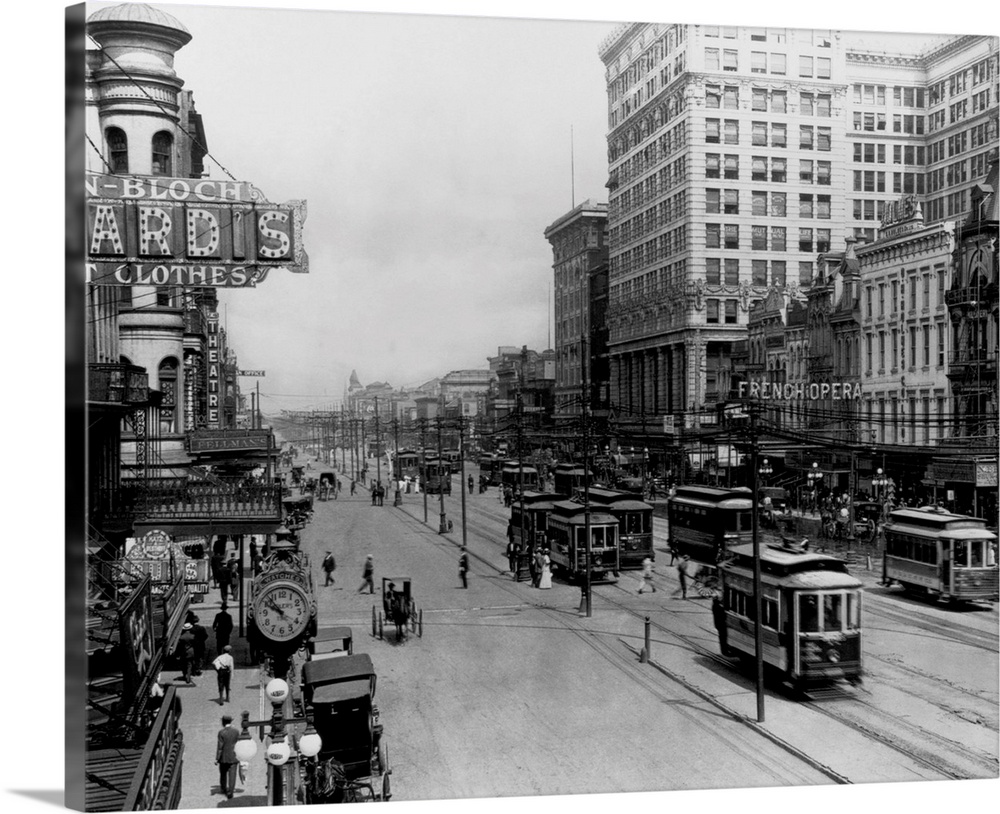 Streetcars run up and down Canal Street in New Orleans.