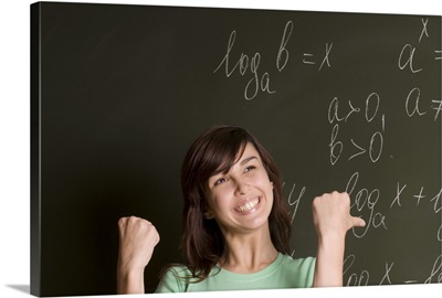 Student in front of blackboard