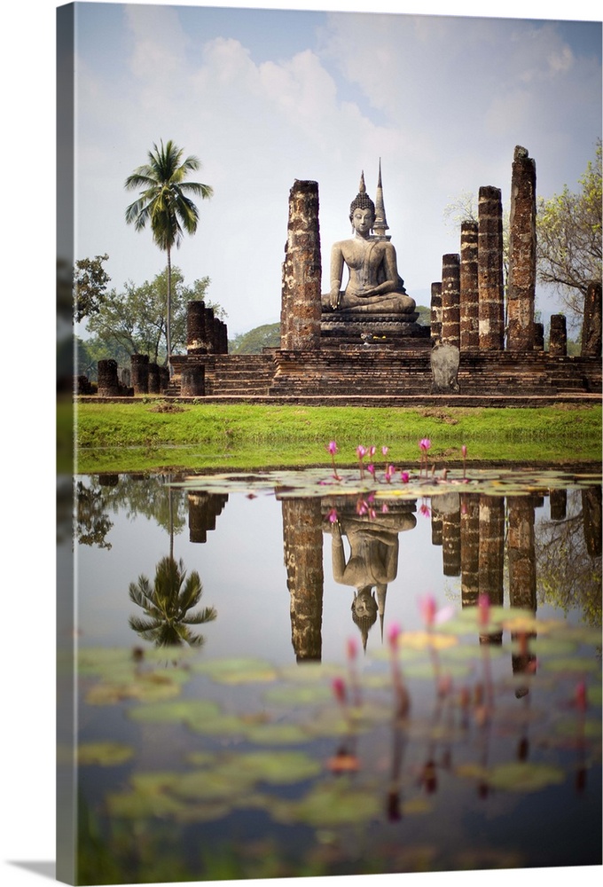 Buddha statue reflection in water at Sukhothai,   Thailand.