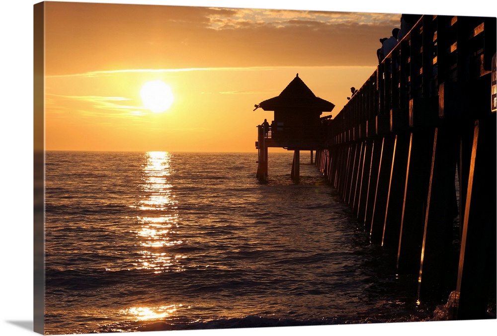 Sunset at Gulf of Mexico with Naples Pier.