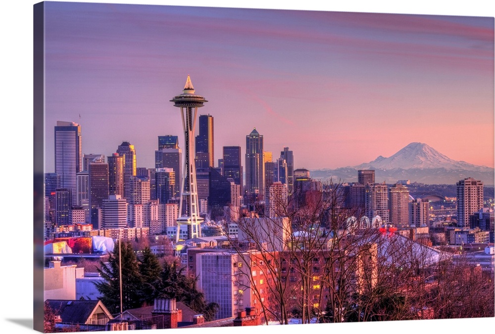 Large photo on canvas of downtown Seattle bathed in warm light from a setting sun.